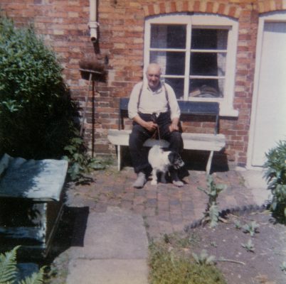 BOT177_044 Marston album2 07 Arthur Marston and his terrier, at home on Queen St, Bottesford