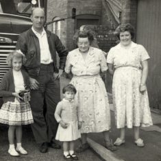 The caption in the photo album:'Janet and Vic Marston, Linda Taylor, Granny [Evelyn Marston] and Daphne Marston, Queen St, Bottesford, 1957 (Vic's lorry).' | Janet Dammes