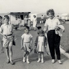 'Mother, Geoff and Janet with cousin Robert at the entrance to the Golden Sands, Mablethorpe.' [probably in 1960] | Janet Dammes
