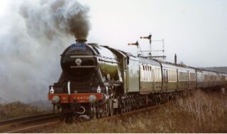 Bottesford for Belvoir - slide 60a The Flying Scotsman heading the Fenman excursion train at Orston Lane crossing, 2007. | Photographer David Middleton.