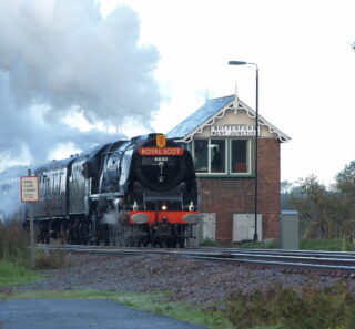 Bottesford for Belvoir - slide 60b The Royal Scot excursion hauled by the Duchess of Sutherland steaming into Bottesford past Bottesford West signal box, 2010. | Photographer David Middleton.