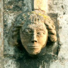 A serene face, on the doorway in the north aisle. | Neil Fortey