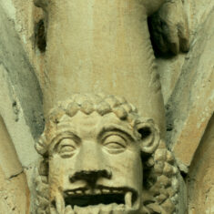 P1050397_06 The ‘manticore’, an evil creature with the body of a lion and head of a man, though with sharp fangs, gapes and snarls from the northern nave arcade. | Neil Fortey