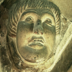 A benign angelic face on the transverse arch at the eastern end of the south aisle. | Neil Fortey