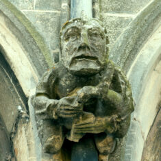 A bagpiper, seen on the northern side of the clerestory. | Neil Fortey