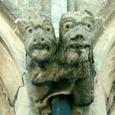 A double carving, showing a bearded man with his arm around a pig-like demonic figure, perhaps his alter-ego, on the northern side of the clerestory. | Neil Fortey