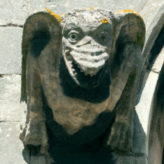 On the south clerestory, one of two dragons that gaze down as though in anticipation of rich pickings among the sinners below. | Neil Fortey
