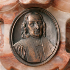 P1060034_05 Thomas White, Rector (1679-1685), Bishop of Peterborough (1685), campaigned against the Declaration of Indulgence but was acquitted by James II in 1688, then was one of the non-juring bishops deprived of his see in 1690 by William and Mary. His memorial plaque is mounted on the east wall of the north transept, rather hidden behind the organ. | Neil Fortey
