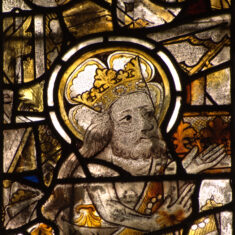 P1070451_03 Medieval stained glass displayed in the SW window of the chancel clerestory. These are all that remains of what was once a large series located in the clerestory of the nave of St Mary’s and described by Nichols (1795). The king is said to be St. Edward the Confessor. | Neil Fortey