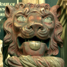The face of the heraldic lion crouching at the foot of Countess Elizabeth.
