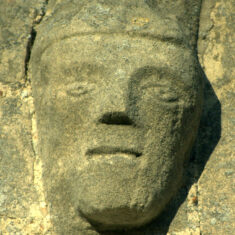 Carved face on the south aisle window. | Neil Fortey