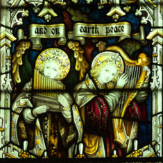 P1090919_02 Part of the Nativity window in the Lady Chapel - angels and worshippers at the birth of Christ. Angels announce the Nativity on medieval instruments. | Neil Fortey