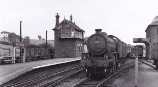 Picture 10#2 A passenger train arriving at Bottesford, 1950s, passing between the signal box and grain warehouse. | From an old postcard, Bottesford Local History Archive