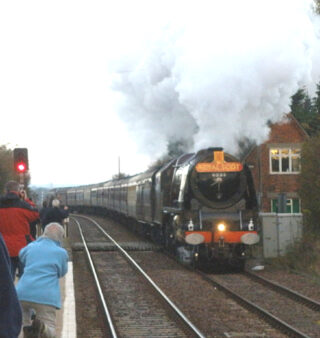 Picture 11#2 An excursion train hauled by the Duchess of Sutherland, passing at speed through Bottesford in 2010. | Photo by Neil Fortey, Bottesford Local History Archive