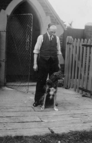 Picture 13 BOT026_032#2a Mr Sellers, Bottesford station gate-keeper, 1953. The old gatekeeper's cottage stood by the level crossing at the western end of the station until finally demolished in 2024, which was a pity because it was one of the original features of the 1850 station and was an elegant building designed by T.C. Hine. | Reproduced courtesy of Mrs Brenda Turier, Mr Seller's grand-daughter. Bottesford Local History Archive.